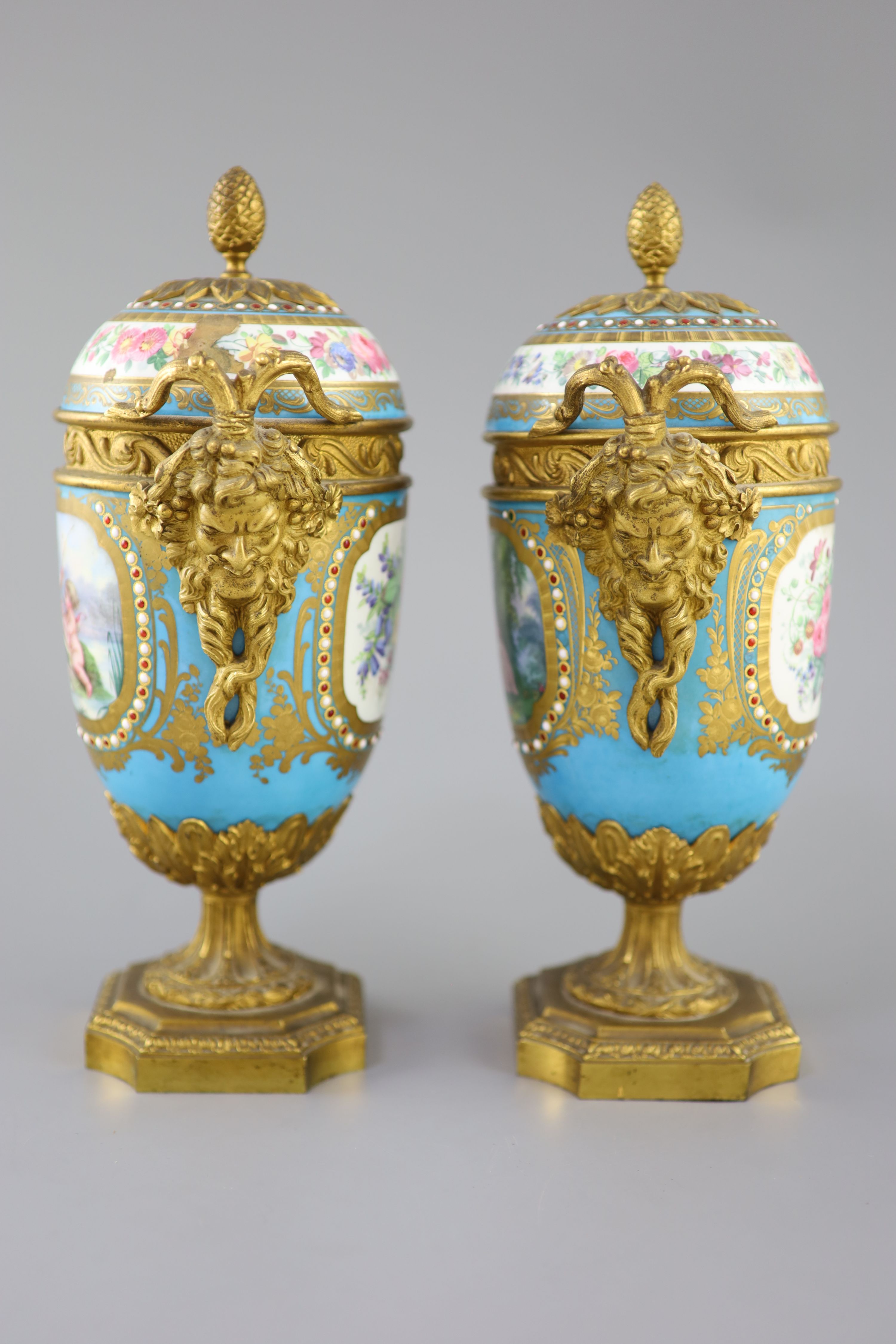 A pair of French Sevres style porcelain and ormolu mounted vases and covers, 19th century, 27cm high